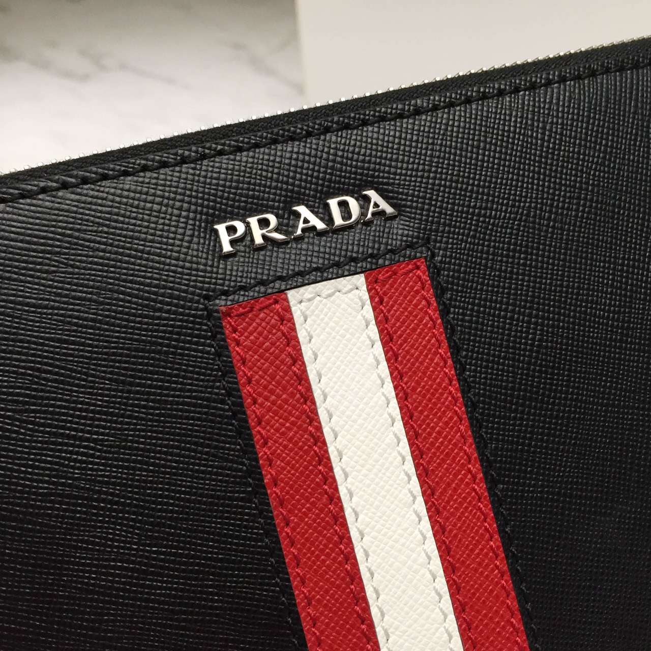 原版复刻PRADA手拿包-高仿一比一普拉达男士钱包包ECS002723商标图